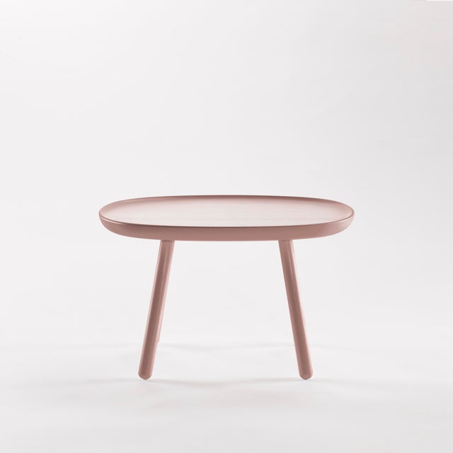 The Na&iuml;ve series of side tables is available in three sizes, each carved out of a single piece of solid ash. A form...