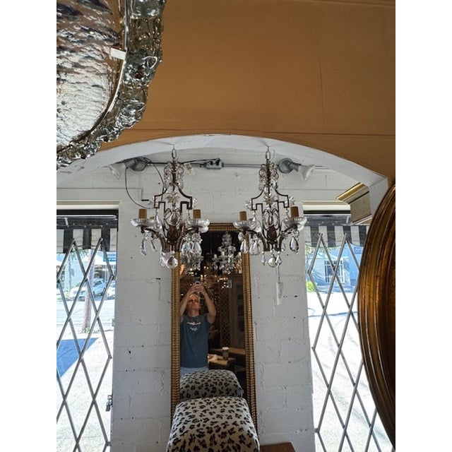 Gorgeous pair of rare petite Maison Bagues silver leaf and crystal chandeliers. These glistening beauties make a real...