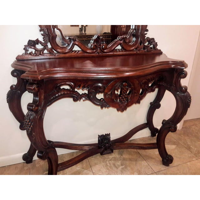 This beautiful vintage hall console table and mirror set is a stunning addition to any indoor space. The mahogany wood...