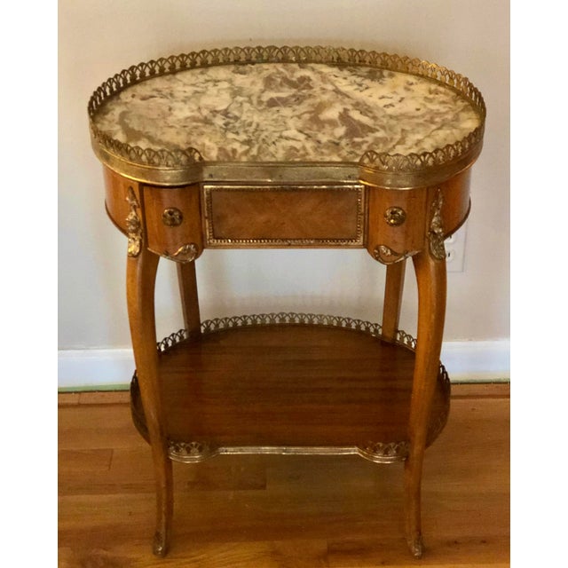 Fine quality French Louis XV style ormolu mounted wood kidney shaped table, beautifully made with its original marble top,...