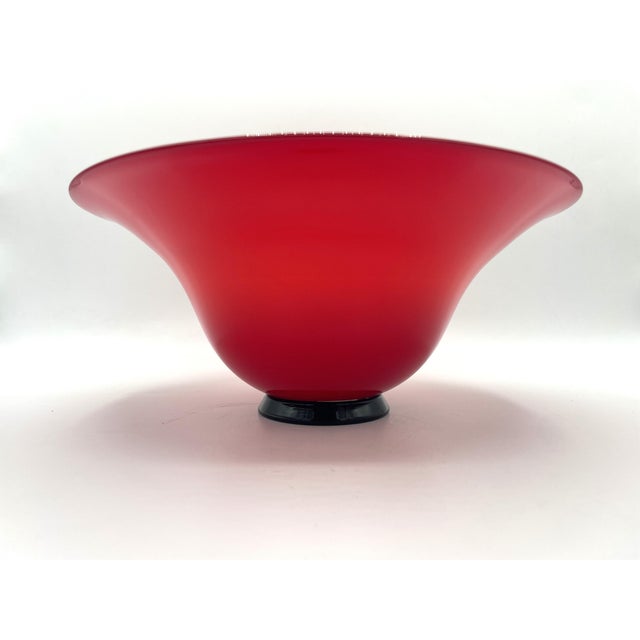 A venini vase from the anni thirties series in red. it is a blown glass piece made in 1989, as can be seen from the...