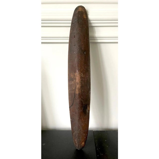 A tall and narrow parrying shield from the Aboriginal people living in the Western Australia. The piece was carved out of...