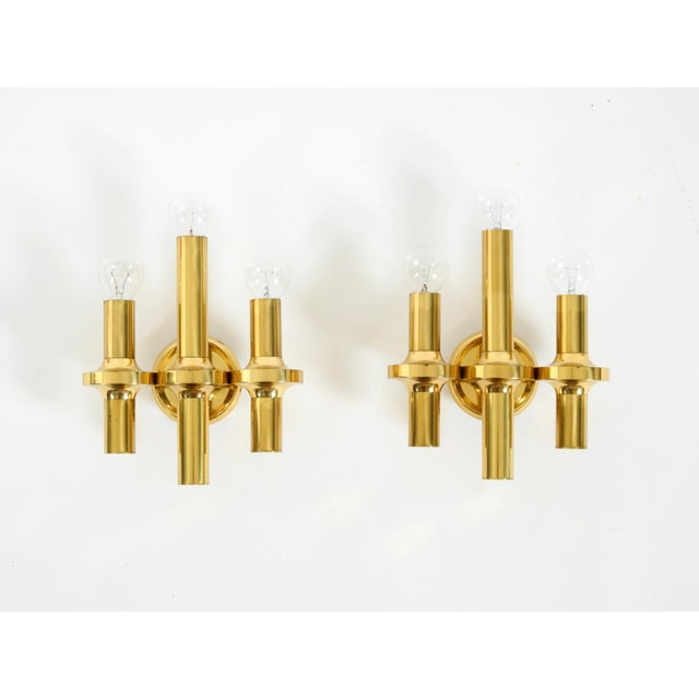 A pair of beautiful, rare brass wall lamps from the 1960s. both lamps are made of polished solid brass. exquisite, elegant...