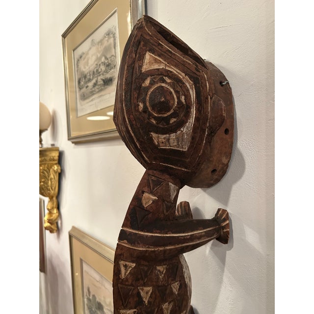 Wonderful hand carved African wall sculpture of a whimsical imaginary animal, naively painted with white details. Wired to...