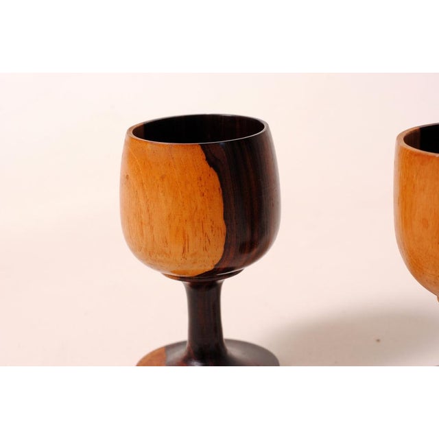 This set of two hand-carved wine glasses embodies the traditional craftsmanship of woodworking. The classic chalice...