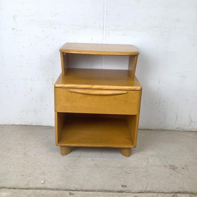 An authentic Heywood-Wakefield bedside cabinet from the celebrated Encore collection, this sculptural mid-century modern...