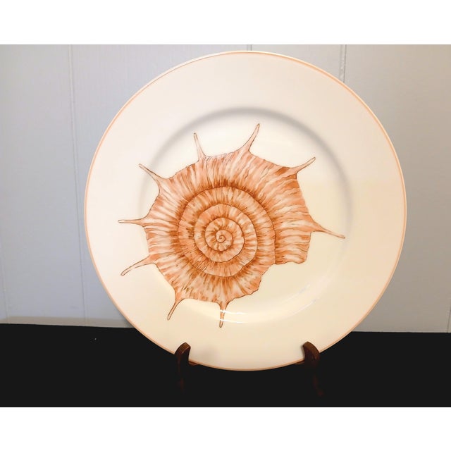 These 4 plates are by Fitz and Floyd in Japan circa. 1977 thru to 1992. The pattern is Coquille, Which is a peach color...