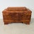 A refined cabinet featuring elegant, rounded detailing in the Art Deco style. It is finished in walnut, treated with...