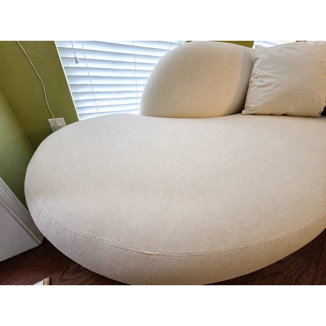 Beautiful matched pair of circa-2000s Weiman sculptural chaise sofas in their original ivory/cream upholstery. Each sofa...
