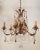 Six scrolled arms formed acanthus leaf gilt iron chandelier. This spectacular piece is adorned with eighty plus clear and...