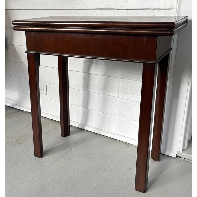 Small 18th century George III mahogany games table with one swing leg, bullnose top edge and chamfered legs. Measures 27...