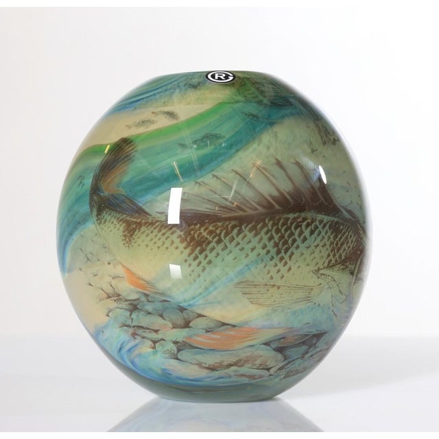 A stunning unique art glass vase in the graal technicue by Swedish designer Robert Oldergaarden with decor of a perch fish...