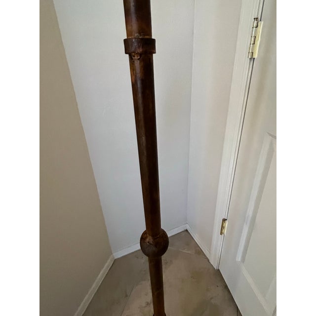 1940s Style French Brutalist floor lamp. It is crafted from forged wrought iron and is characterized by its distinctive...