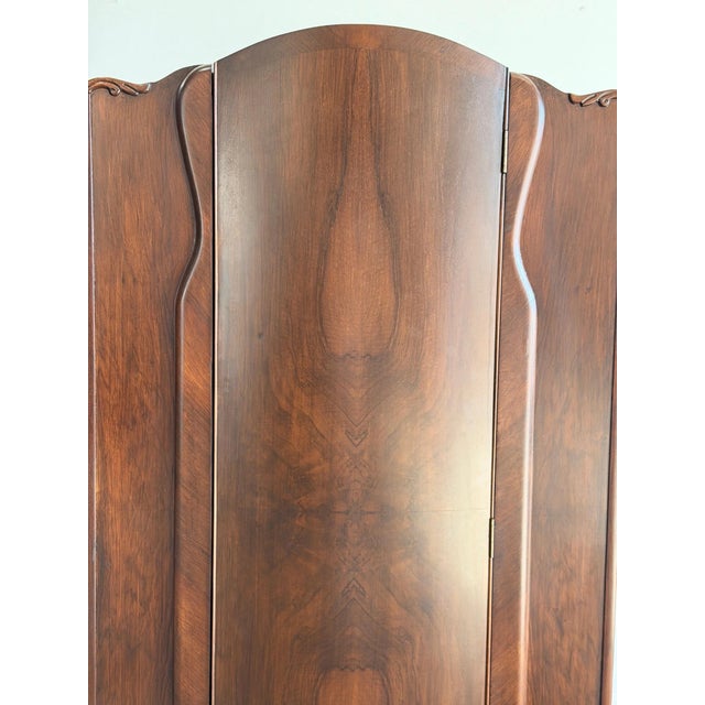 W35 D19.75 H63.75 This fully restored, classic vintage art deco armoire stands gracefully with embellished sculptural...