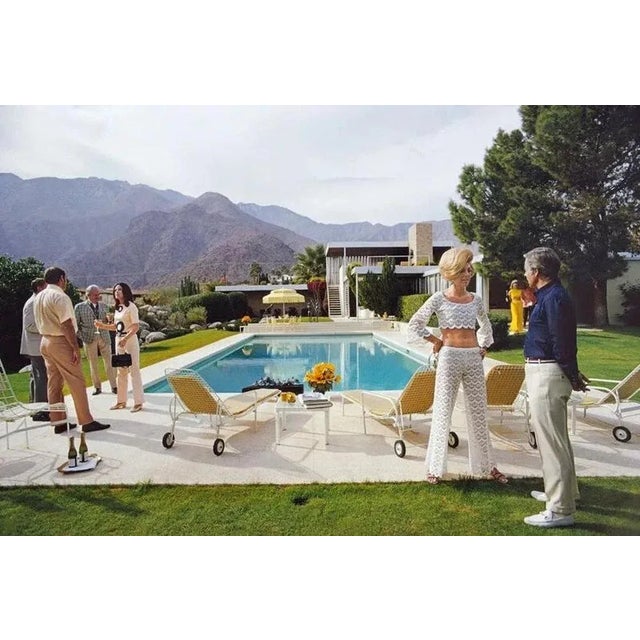 Poolside Conversation 1970 by Slim Aarons Slim Aarons Limited Estate Edition Former fashion model Helen Dzo Dzo Kaptur (in...