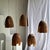 Large pendant light or lampshade in natural, organic, tubular teak. Height: approximately 40cm; Diameter: approximately...
