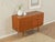 Classic sideboard from the 1960s. Corpus in teak veneer with four drawers, one door, one shelf and tapered legs. Quality...