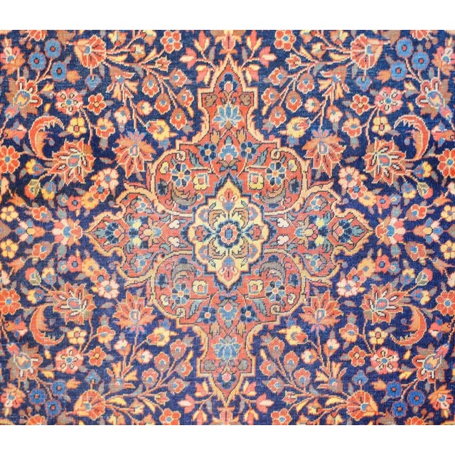 An unbelievable early 20th century Persian Kashan rug with an intense and densely woven all-over large and small-scale...