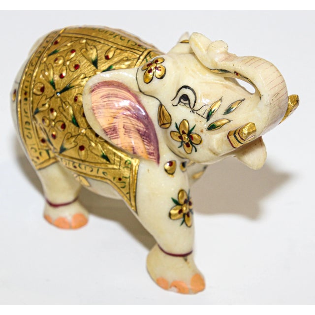 Vintage jeweled elephant sculpture paper weight wearing traditional ceremonial costume. Finely hand painted animal...