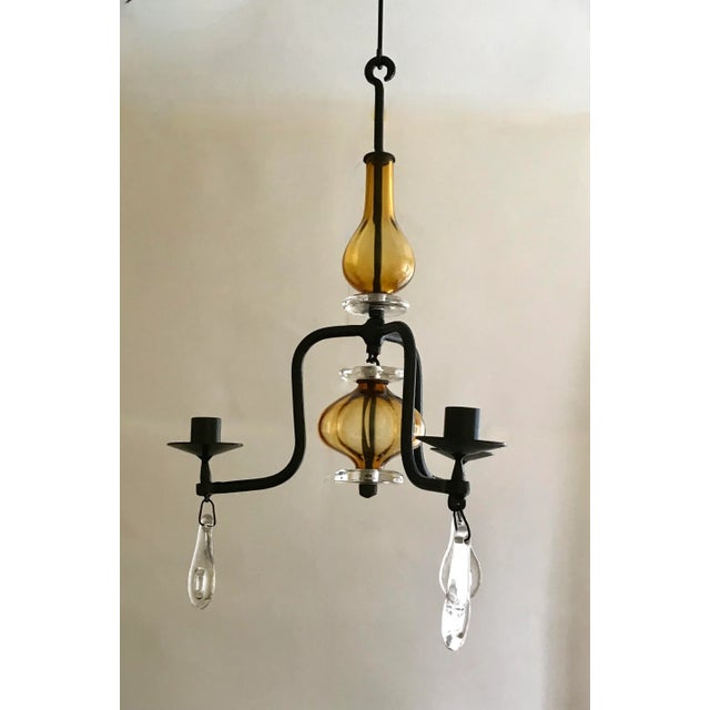 Mid Century wrought iron and glass chandelier designed by Eric Hoglund and manufactured by Boda Glassworks, Sweden 1960s....