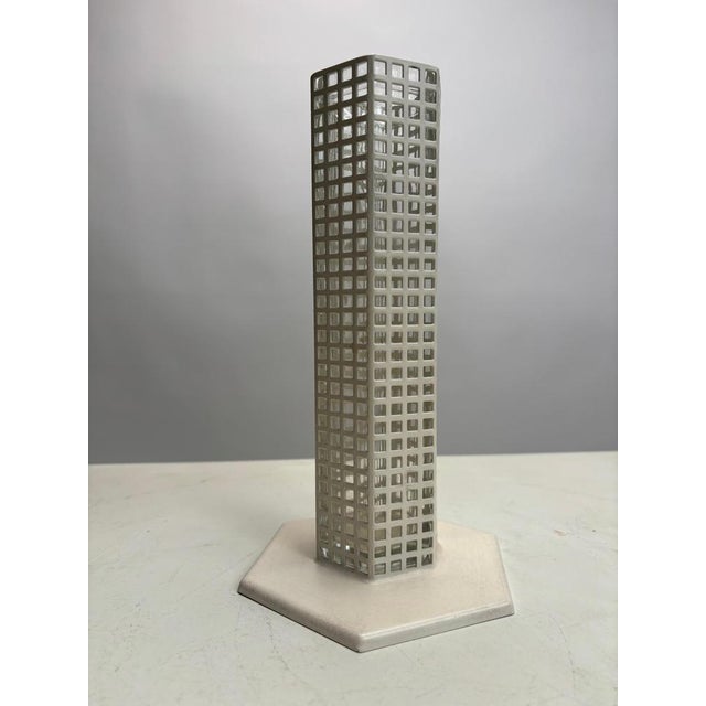 This flower vase, designed by Josef Hoffmann around 1905 for the Wiener Werkstätte, evokes the shape of a modernist...