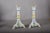 Pair of hand-painted ceramic candlesticks from the 1910s. Each has a flared footed base, scalloped edges, blue, yellow and...
