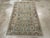 This Mid-20th century Persian Malayer rug, measuring 3' 4" x 5' 7", is a fine example of the village weaving traditions...