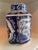 This is a lidded ginger jar featuring traditional blue and white Chinoiserie motifs. The design typically includes...