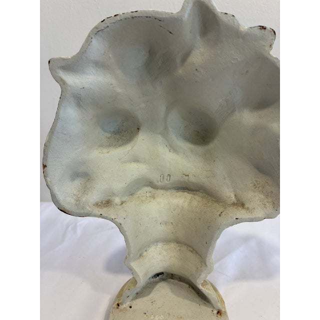 A charming vintage cast iron doorstop modeled as a bouquet of blooming roses displayed in a classical urn. Hand-painted...