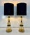 Elegant pair of table lamps produced in Italy and crafted from stacked Murano glass elements. The sculptural composition...