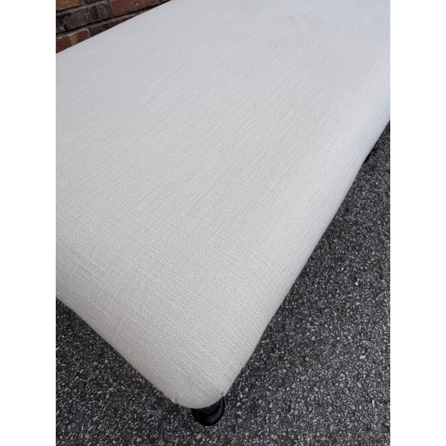 Beautiful antique newly upholstered bench! The fabric is a stylish transitional off white. The base has 6 nicely turned...