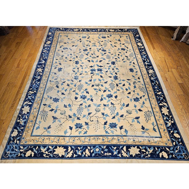 This exquisite oversized Chinese Peking rug from the late 19th century is a rare treasure of timeless elegance and...