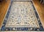 This exquisite oversized Chinese Peking rug from the late 19th century is a rare treasure of timeless elegance and...