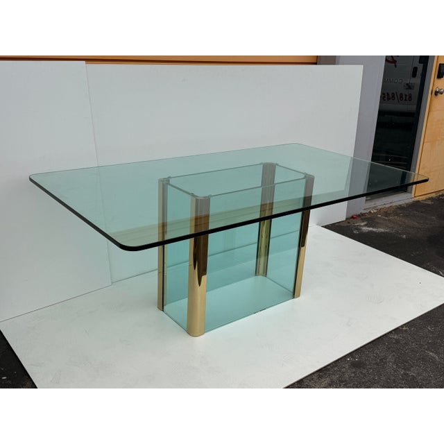 Leon Rosen for Pace Collection rectangular shape glass and brass dining table. Glass top is 3/4” thick by 72” wide , 40”...