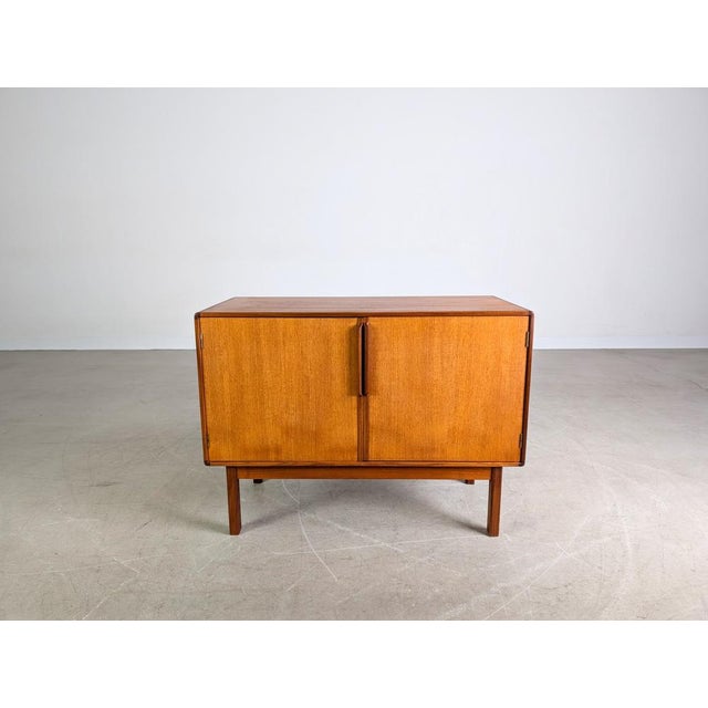Beautiful vintage sideboard/credenza by Asko Finland from the 1960s. The piece offers generous storage space behind two...