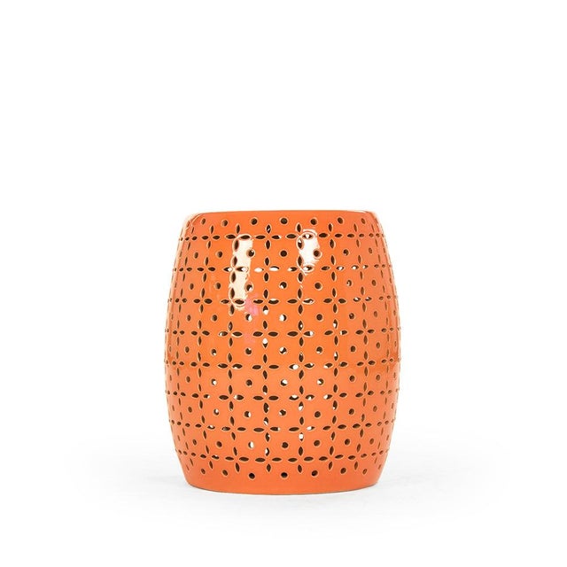 The Lovell Garden Stool is a ceramic garden stool with a barrel form and a delicate petal-flower pierced pattern in a...