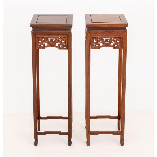 Pair of Chinese Hardwood Pedestal Stands, each reticulated apron with mythical beast motif. 36" H x 11" W x 11" D....