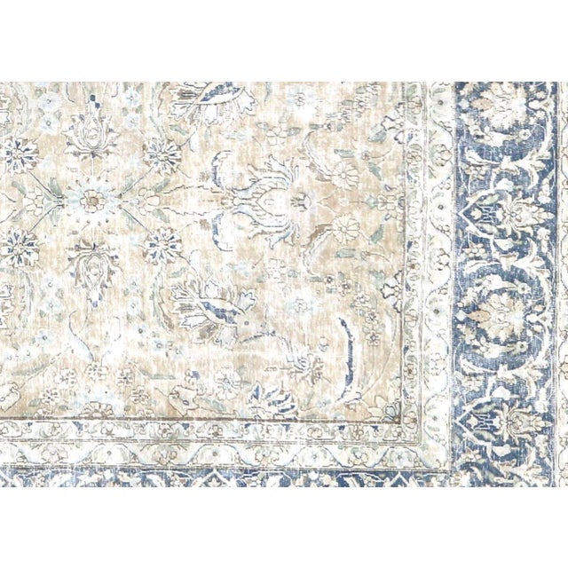 1950s Persian Kerman Rug. Hand woven in the Kerman region of Iran. Distressed and refinished in the U.S. The Persian...