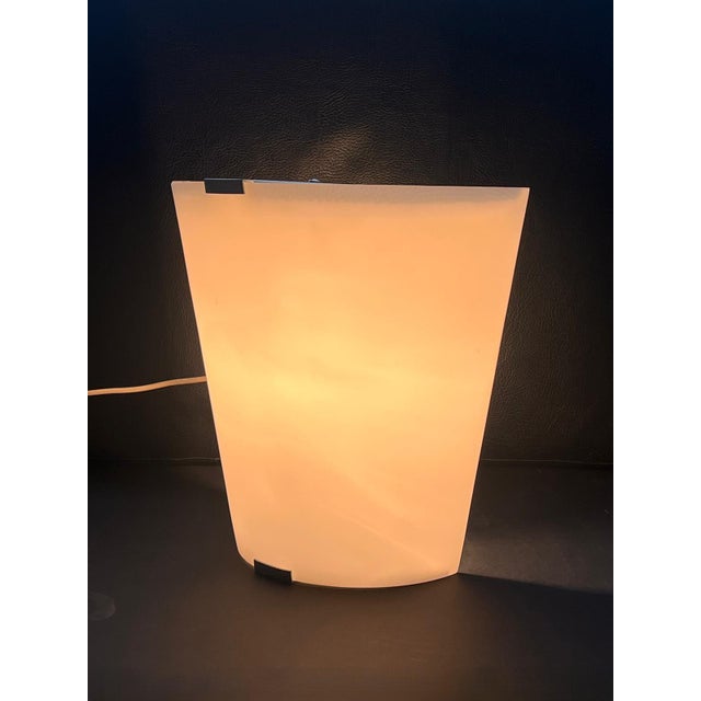 A stunning pair of wall lamps (sconces) produced by the renowned Italian manufacturer Martinelli Luce. These lamps embody...