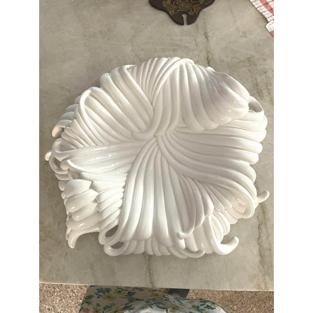 Large white ceramic "noodle" charger or centerpiece made in Italy by Apex International. The dramatic and sculptural...
