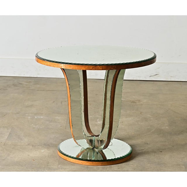 A sleek and sculptural vintage French mirrored gueridon (an end or side table) to instantly brighten up any room. The top...