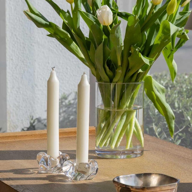 Beautiful pair of glass candle holders from France, 1950s. Gently sculpted flower shaped glass. Acid etched signature on...