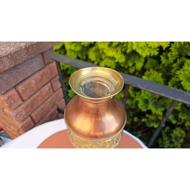 Art Nouveau brass vase with embossed floral pattern, dimensions: height 34.5 cm, top diameter 11.7 cm.