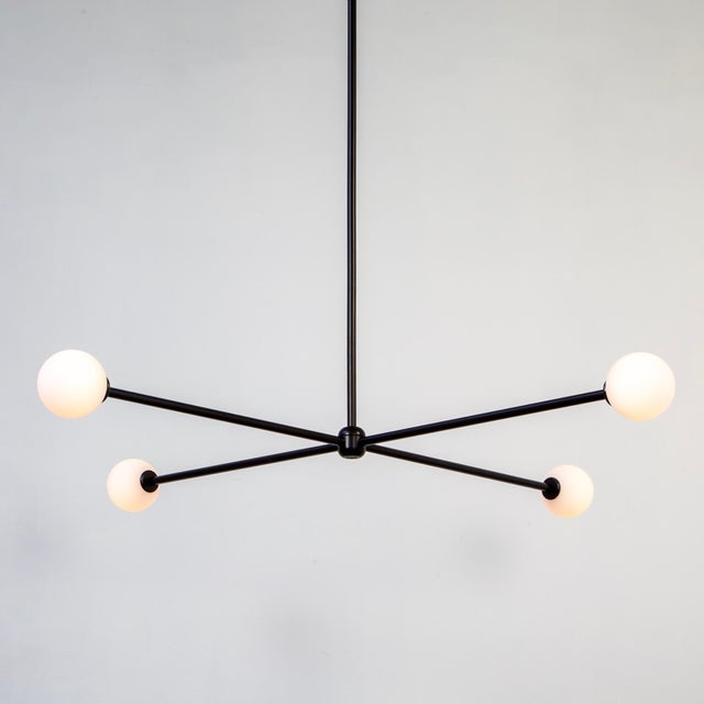 This listing is for 1x Globe 4 Chandelier by Research.Lighting. It’s a floor model that was used in a photoshoot but is in...