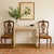 This authentic pair of antique Italian side chairs features exquisite hand-carved detailing, elegant cabriole legs, and...