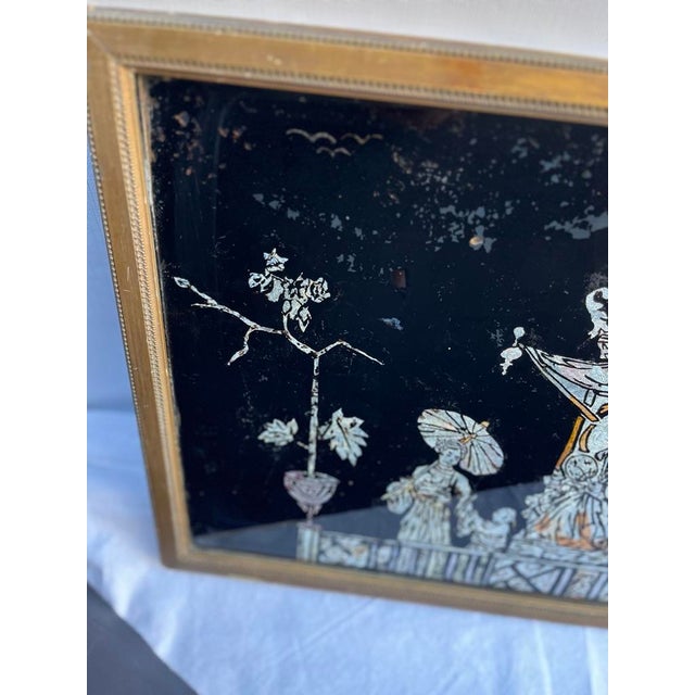 A single rectangular antique English tinsel painting on glass featuring a Chinese court scene including a pagoda, figures,...