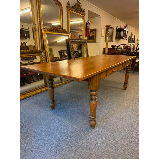 Custom English pine Rustic Farmhouse dining table crafted in the late 20th century (circa 1980). Constructed from solid...