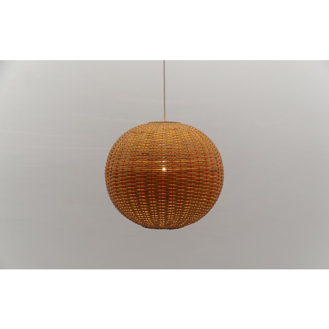 Beautiful and rare decorative Mid-Century Modern pendant lamp. Designed and manufactured probably in Scandinavia, 1960s....