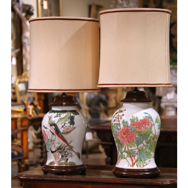 This elegant pair of vintage porcelain lamps was converted from lidded Chinese vase jars, beautifully hand-painted in the...