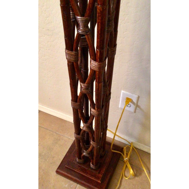 Unique twisted rattan circles floor lamp. Creative use of rattan entertained circles make a unique lightening experience....